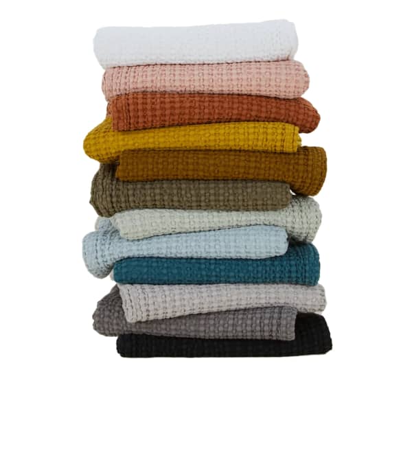 Premium Photo  Rolled cotton fluffy towels of different colors in